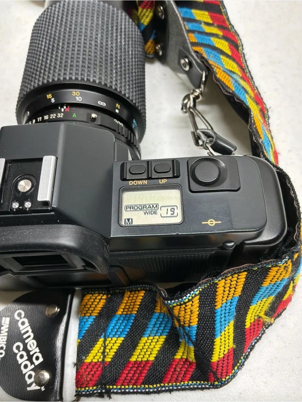 Canon T70 35mm SLR Camera with Black Telephoto Lens and Accessories